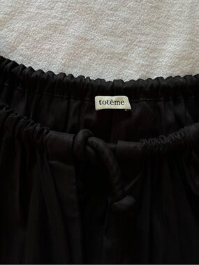Toteme blouse black with elastic waist full body and sleeves